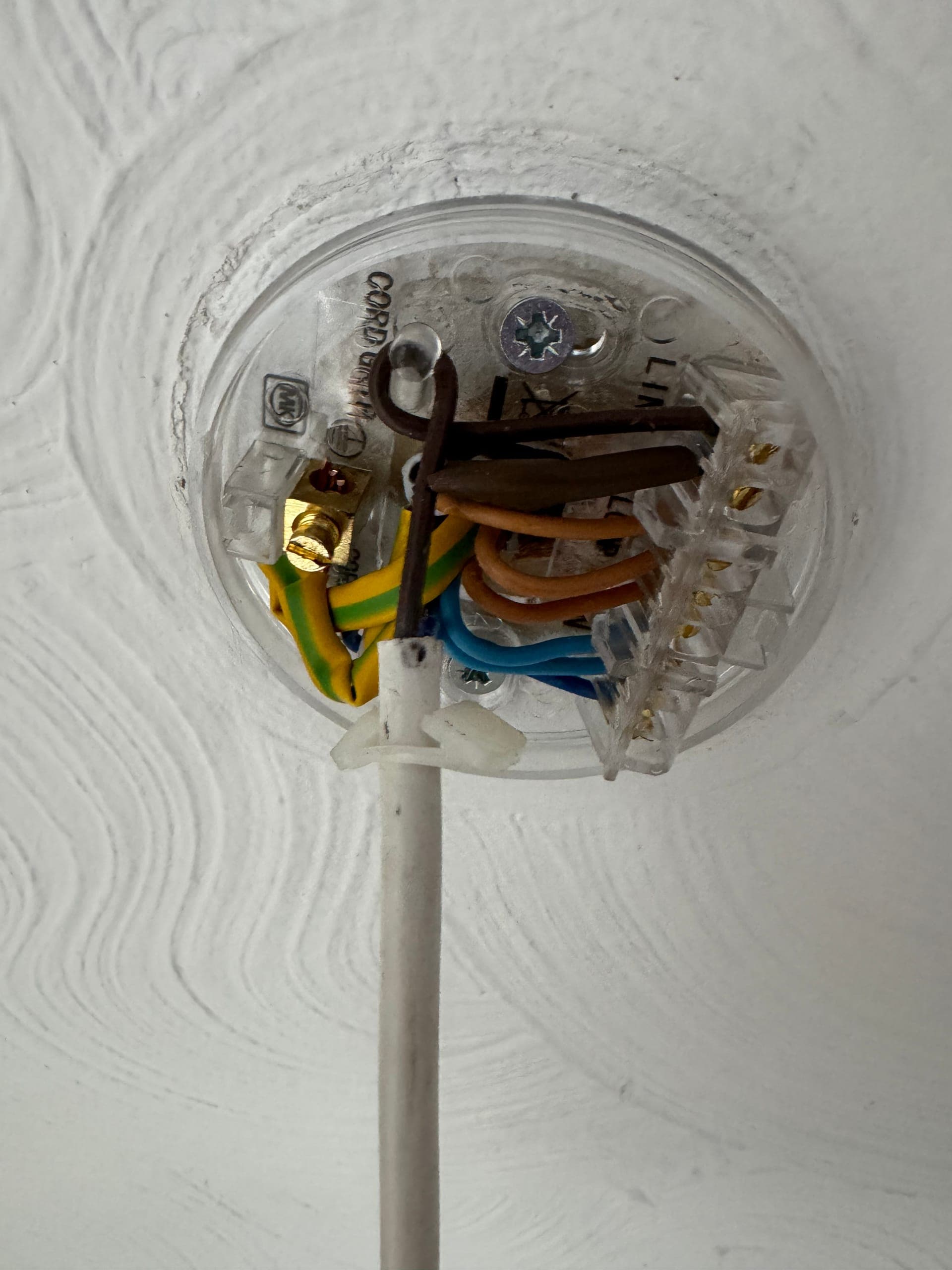 Ceiling rose opened up to show loop-in wiring with the pendant flex connected