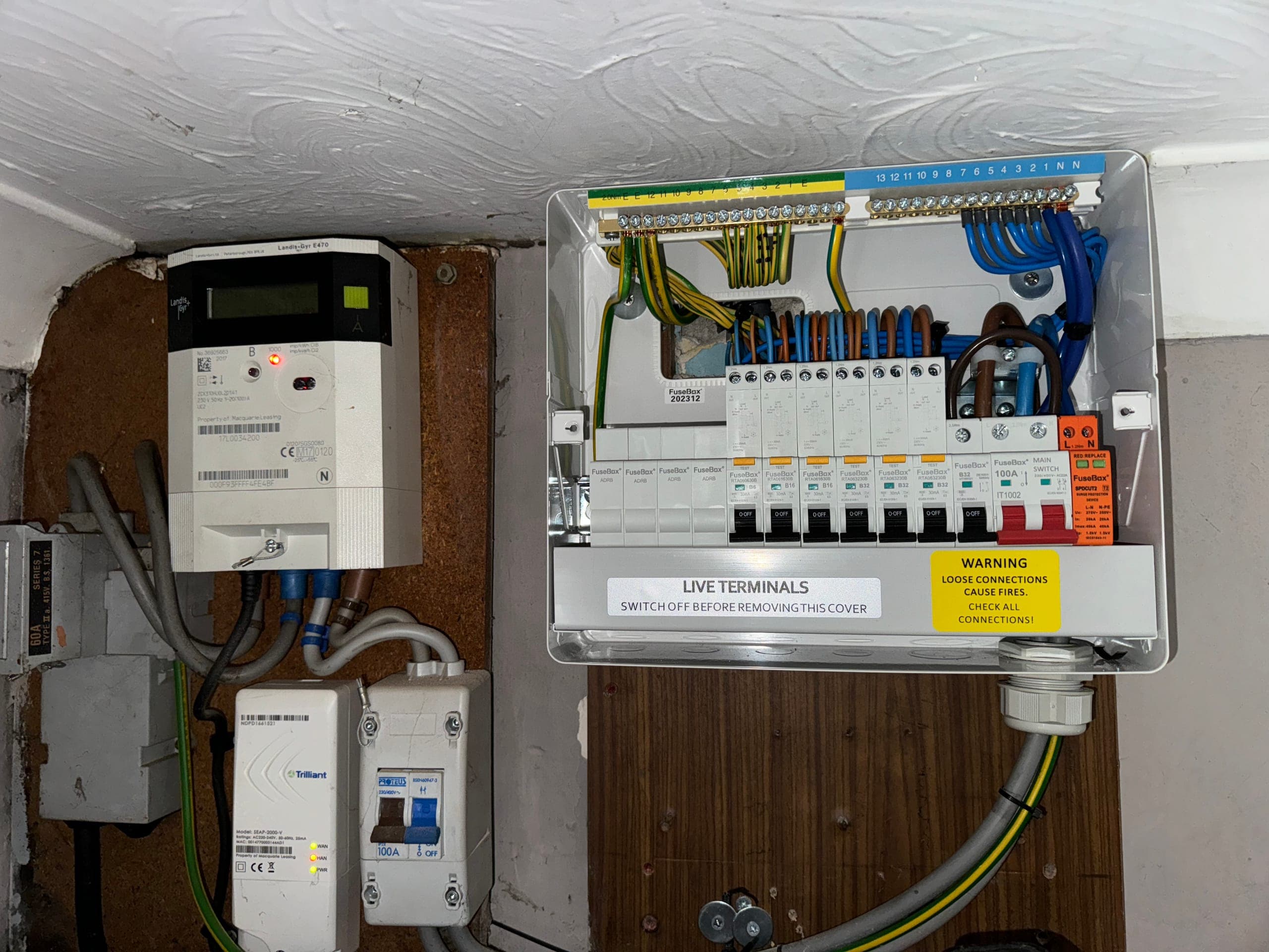 Newly fitted FuseBox consumer unit with RCBOs and surge protection, beside the smart meter and 100A service head