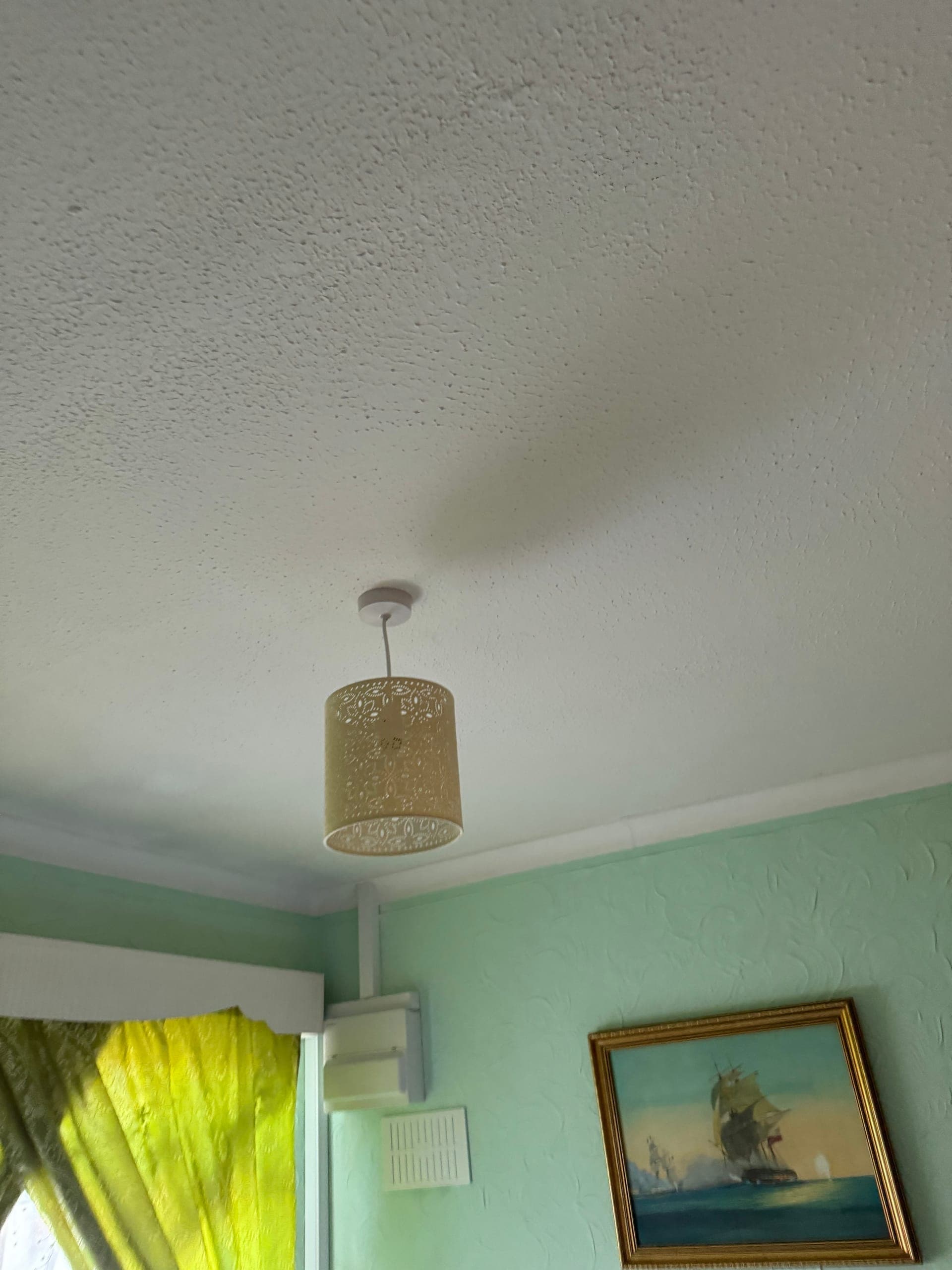 Pendant light and shade hung from a new ceiling rose