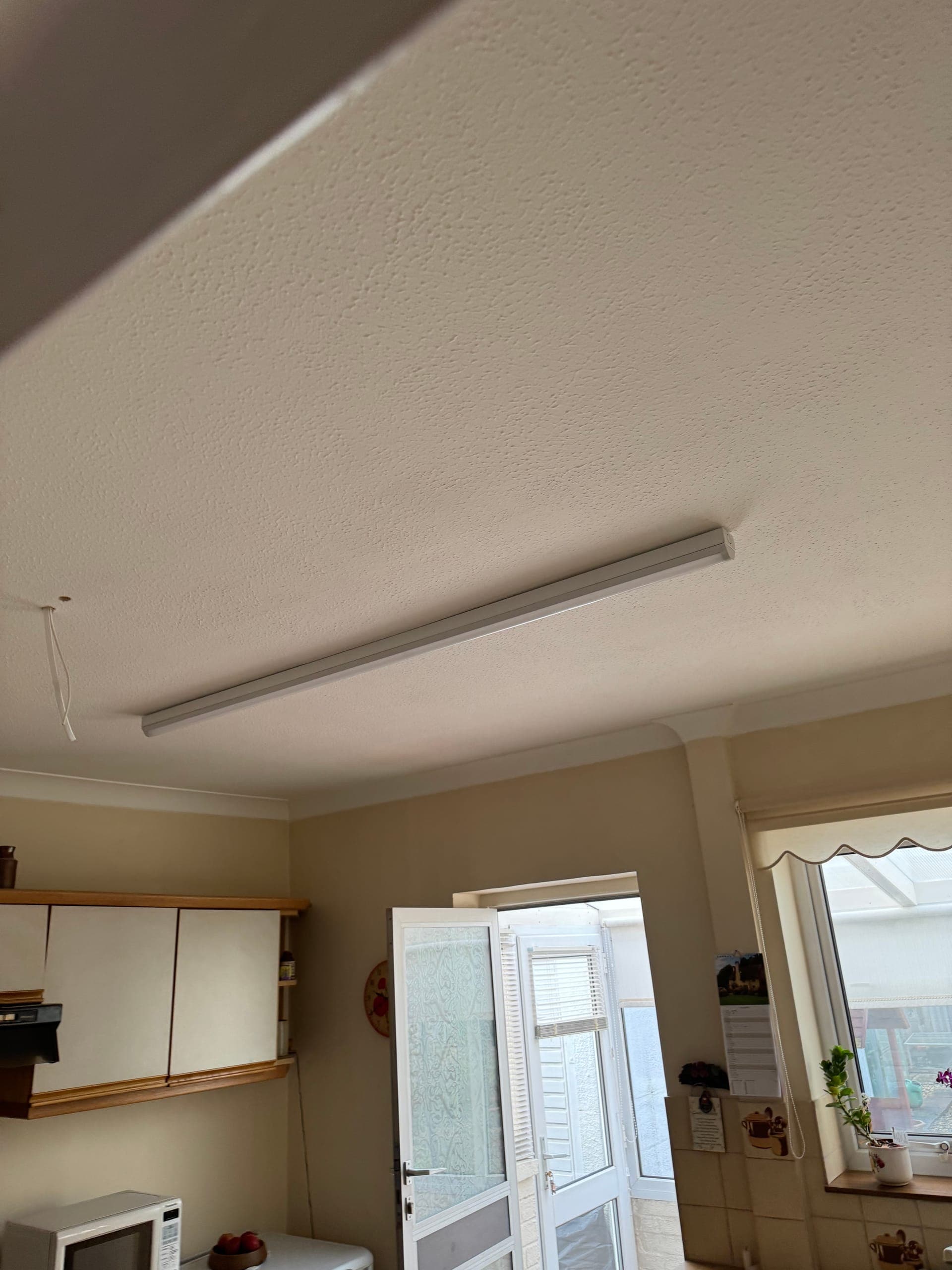 LED batten light fitted across a kitchen ceiling